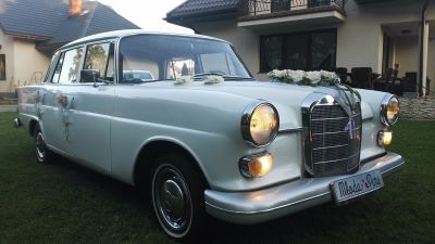 Samochód do ślubu - Łapy biały Mercedes-Benz 110 